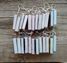 a bunch of books that are sitting on some kind of table cloth with chains attached to them