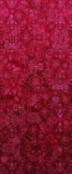 a red rug with an intricate design on it