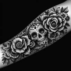 a woman's arm with flowers and a skull tattoo on the left side of her arm