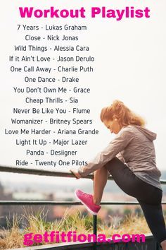 a woman leaning on a rail with the words workout playlist in front of her