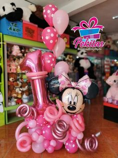 a minnie mouse balloon sculpture in a store