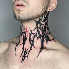 a man with tattoos on his neck and chest