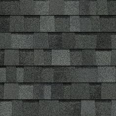 a close up view of a roof with gray shingles