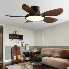 a living room with a couch, table and ceiling fan in the middle of it