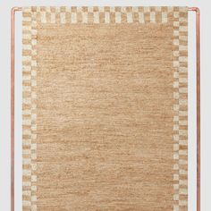 an area rug with checkered design on the front and back, in beige tones