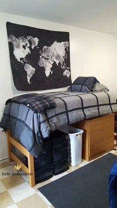 a bed sitting in the middle of a bedroom next to a blue chair and table