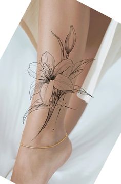 a woman's leg with flowers drawn on it