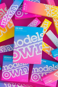 the models own brand logo is displayed on top of colorful candy bar wrappers