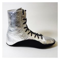 "Custom made Tightwire Boots in Silver metallic leather upper with Black Sole Fitted with hard-wearing suede soles, which curve high on either side of the foot for protection and comfort on the tightwire -Made to your foot measurements  -Leather Lining & insole -Black heavy duty Suede Sole  -Silver eyelets -choice of Silver or Black laces -Height of boots 7\" inches (18cm) from floor to top edge Sizes are shown in UK size - for the international shoe size chart please CLICK HERE. Please contact Boots Suede, Black Laces, Shoe Size Chart, Metallic Leather, Shoes Black, Circus, Mars, Black Shoes, Metallic Silver