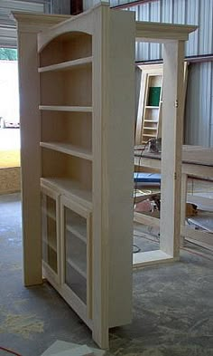 an unfinished bookcase in the process of being built into a room with other furniture