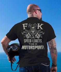 a man wearing a t - shirt that says f k speed limits this is motorsports