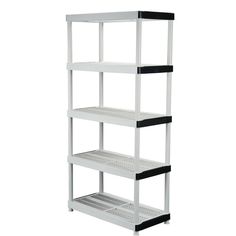 a white shelving unit with black shelves on the bottom and bottom shelf below it