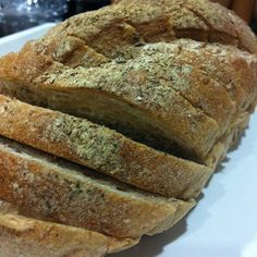 a loaf of bread sitting on top of a white plate