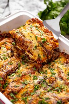 lasagna casserole with meat and cheese in a white dish