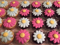 cupcakes decorated with pink, white and yellow flowers