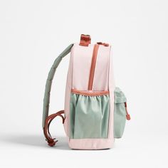 A backpack that's extra comfy and ready to handle all the adventures of the day. Combining colorblocks of candyfloss pink and mint green with pops of coral trim, the kids' medium knapsack is constructed of supremely durable polyester made from recycled water bottles. A roomy interior holds everything your kid needs-books, school supplies, extra layers-and there's a padded pocket to keep their tablet protected. Outside pockets hold snacks, water bottles and more. Pair this book bag with the match Pink Lunch Box, Books School, Monogram Backpack, Kids School Backpack, Pink And Mint, Kids Backpack, Medium Backpack, Clothes Pictures, School Backpack