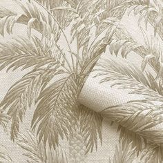 a close up view of a wallpaper with plants and pineapples on it