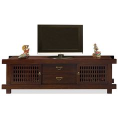 an entertainment center with two drawers and a flat screen tv mounted on the top shelf