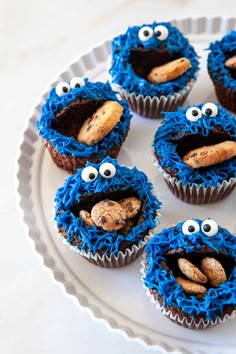 cupcakes with blue frosting decorated like cookie monster eyes