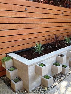 several different types of planters are shown in this collage, including concrete blocks and succulents