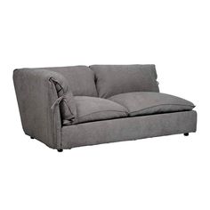 a gray couch sitting on top of a white floor