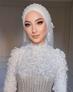 a mannequin wearing a white dress and veil