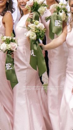 the bridesmaids are all wearing pink dresses with green sashes and bouquets