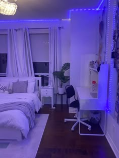 a bedroom with purple lighting and white bedding