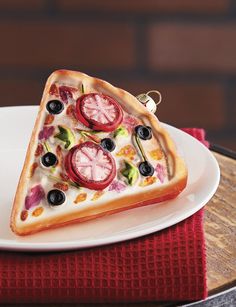 a slice of pizza on a plate with the words hummmm pizza written above it