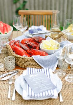 lobsters and watermelon are served in baskets on the table for guests to eat