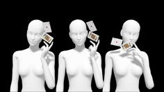 three mannequins holding playing cards in their hands