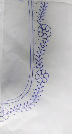 a piece of white paper with blue stitching on it and a flower design in the middle