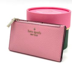 Brand New With Tag Kate Spade Leila Small Slim Bifold Wallet Product Details Color: Bright Carnation 3.1" H X 5.5" W X 0.9" D Pebbled Leather Ksny Metal Pinmount Logo Two Way Spade Jacquard Lining Interior: 5 Credit Card Slots, Id Window, 2 Slip Pockets Exterior: Top Zip Coin Compartment On Front Of Wallet Snap Closure Dust Bag Not Included Imported Pink Rectangular Feminine Wallet, Pink Feminine Rectangular Wallet, Feminine Pink Wallets For Daily Use, Chic Pink Wallet For Everyday Use, Pink Feminine Wallet For Everyday Use, Chic Pink Wallets For Everyday Use, Feminine Pink Wallet For Everyday Use, Pink Feminine Wallet For Everyday, Chic Pink Bifold Wallet