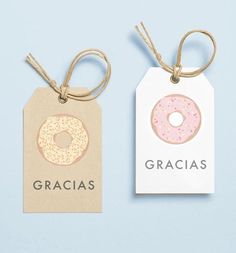 two tags that say gracias and one has a donut with sprinkles on it