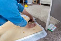 a person is sanding up some wood on the floor