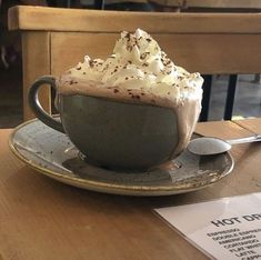 a cup of hot chocolate with whipped cream on top