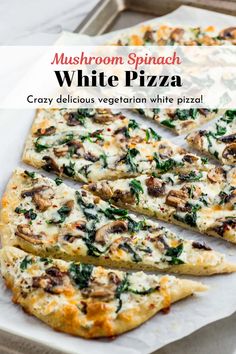 mushroom spinach white pizza is cut into slices