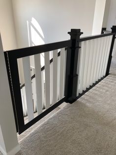 a white and black railing in an empty room