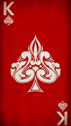 a red playing card with white designs on it