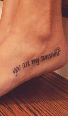 a foot with the words you are my sunshine written on it