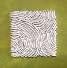 an abstract painting of white wavy lines on a green background