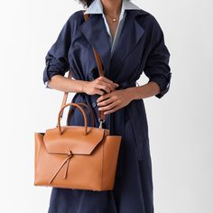 Are you ready to be that stylish woman who walks into the office with one leather tote that does it all? The Loren Tote is the ultimate everyday work bag because it’s made with our signature lightweight Italian leather that holds its shape over time, doesn’t scratch and is easy to clean. Plus, it’s spacious, stylish and so lightweight, that it won’t break your back. Timeless Shoulder Bag For Travel In Fall, Timeless Cognac Satchel With Detachable Handle, Versatile Cognac Shoulder Bag For Business, Timeless Cognac Satchel For Travel, Versatile Cognac Bag With Smooth Grain, Fall Satchel With Top Handle And Leather Lining, Elegant Cognac Shoulder Bag For Travel, Fall Top Handle Satchel With Leather Lining, Chic Everyday Cognac Satchel