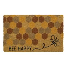 a door mat that says bee happy with a drawing of a honeybee on it