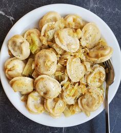 a white plate topped with sliced bananas and onions