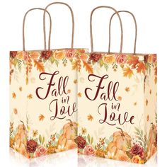 two paper bags with the words fall in love on them