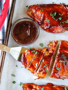 bbq ribs with barbecue sauce and parsley on the side, ready to be eaten