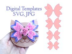 a hand holding a small wooden cat with pink flowers on it's head and the words digital templates svg, jpg