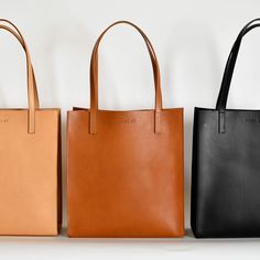 Tall market tote crafted in buttery soft and smooth vegetable tanned leather and an unlined interior. The sleek minimal design makes it a great everyday bag for work, school or a visit to the farmers market. It features reinforced bottom support and large interior pocket to keep your keys and phone close by. - Smooth Full Grain Italian Vegetable-Tanned leather - Unlined Interior - Includes 1 large interior pocket - Reinforced bottom support - Handcrafted in Italy in an ethical factory - Color: B Minimalist Leather Tote, Diy Leather Tote, Leather Bag Design, Minimalist Tote, Slouchy Bag, Leather Totes, Simple Leather, Market Tote, Leather Products