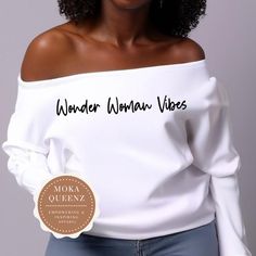 Channel your inner superhero with this Wonder Woman Off The Shoulder Shirt! Made from soft and comfortable material, this shirt features Wonder Woman Vibes that will make you feel powerful and confident. Perfect for fans of the legendary Amazonian warrior, this shirt is great for casual wear or to showcase your love for strong and empowering women. Stand out from the crowd and show off your feminist pride with this stylish Wonder Woman Shirt! This cute Wonder Woman Off the Shoulder sweatshirt is Wonder Woman Shirt, Amazonian Warrior, Off The Shoulder Sweatshirt, Feel Powerful, Off The Shoulder Shirt, Superhero Shirt, Woman Shirt, Mom Sweatshirt, Empowering Women