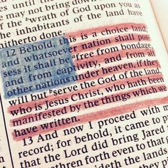 an open bible with the american flag painted on it's page and words written in red, white and blue